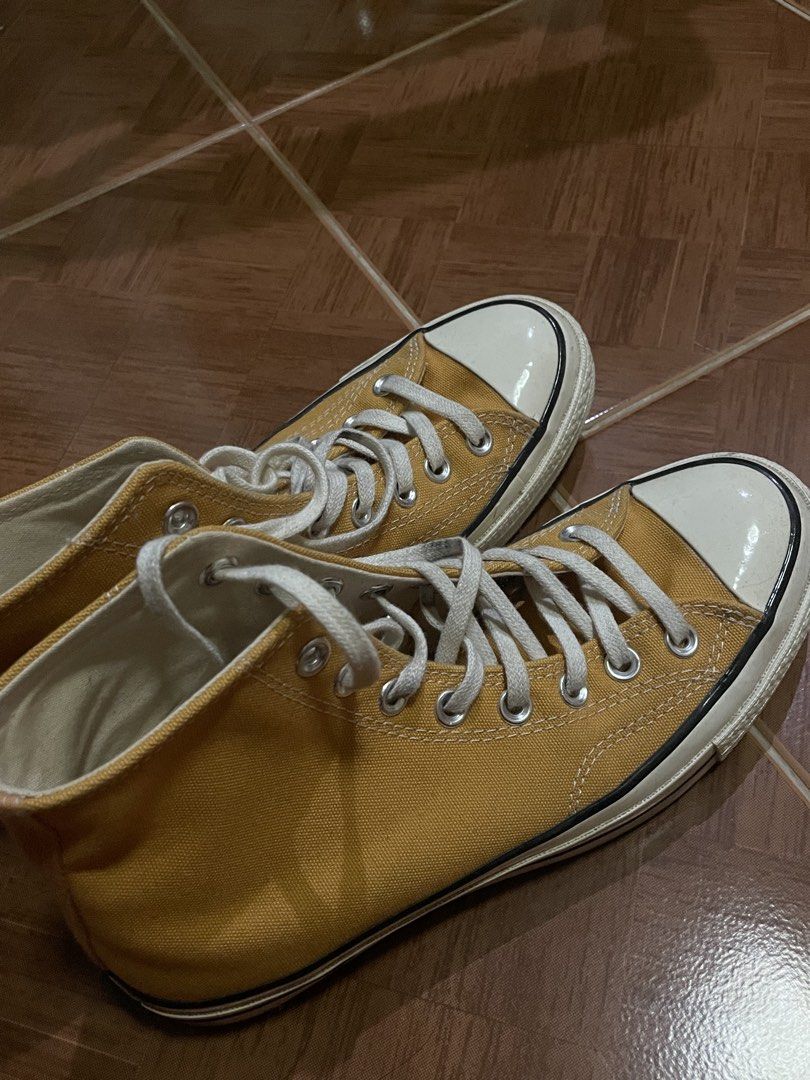 Converse Chuck 70 High Top Sunflower Yellow (Category: Sneakers) located in Manila. Submitted by ninchyyy (Listing ID 1465072831, Image 2). Description: - Color: Sunflower yellow canvas - Model: Iconic high-top Chuck 70 - Details: Classic black & white foxing tape, vintage heel license plates, white laces and toe caps - Condition: Minor dust on rubber midsoles from brief wear; canvas is clean and bright - Style: Great everyday rotation shoes.