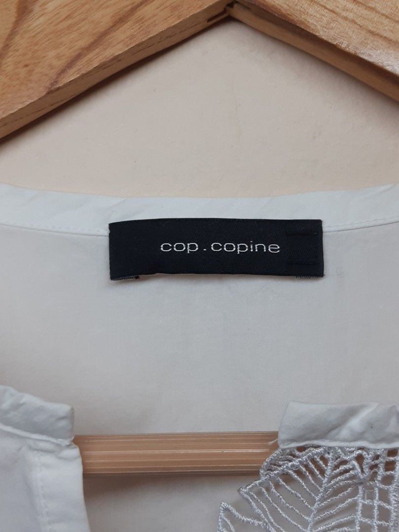 SALE: cop.copine VOLADE top (Category: Luxury Apparel) located in Bauang. Submitted by 2ndskinz_by.irie (Listing ID 1464970803, Image 3). Description: Volade Top by Cop.Copine is a sleeveless, A-line top featuring a round neckline with a deep V-décolletage and a delicate guipure lace panel shaped like a leaf. Size: 36 tagged Measurements: Length: 22.5" Width: 17" authentic Product Details • Design: Sleeveless A-line cut with a leaf-themed guipure
