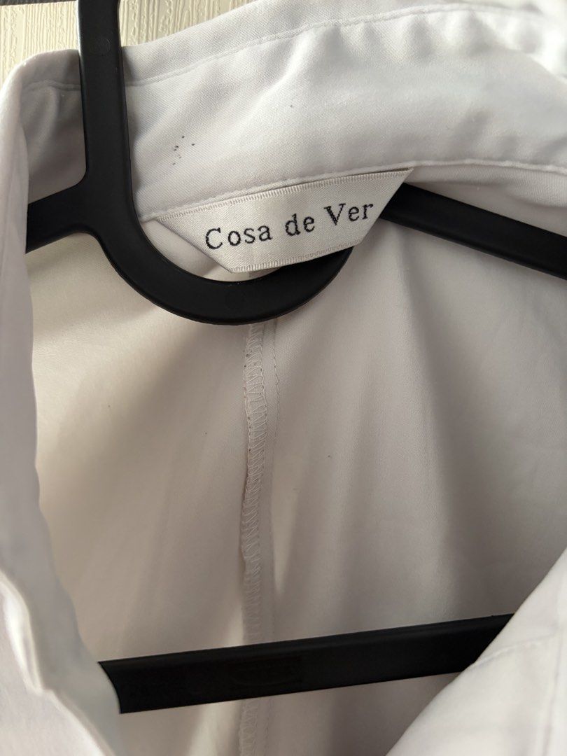 Cosa de Ver Light Gray Office Siren Long Sleeve Button Down Blouse (Category: Longsleeves) located in Dasmarinas. Submitted by prelovedbyxai (Listing ID 1464992386, Image 2). Description: - Brand: Cosa de Ver - Color: Light Gray - Size: XS-S frames - Fabric: High quality, soft, kinda stretchy with a smooth finish - Style: Standard office wear (office siren) or as a smart casual top, gives you flattering fitted silhouette - Condition: No other fla