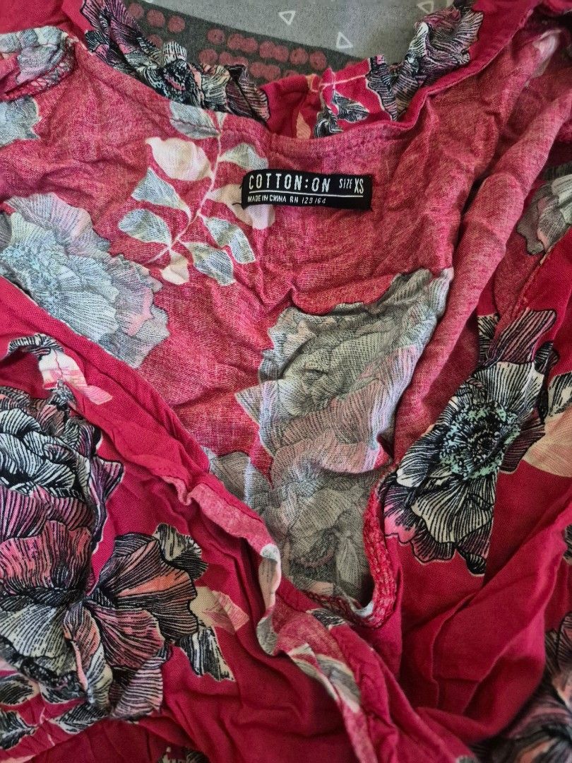 Cotton On Floral Romper (Category: Rompers) located in Pasig City. Submitted by ces.maranan16 (Listing ID 1465071461, Image 3). Description: - Brand: Cotton On - Design: Bright pink with dark floral print - Features: Deep V-neckline with ruffle trim, long sleeves, elastic waist - Fabric: Super lightweight, ideal for warm weather and casual days out small to Medium .