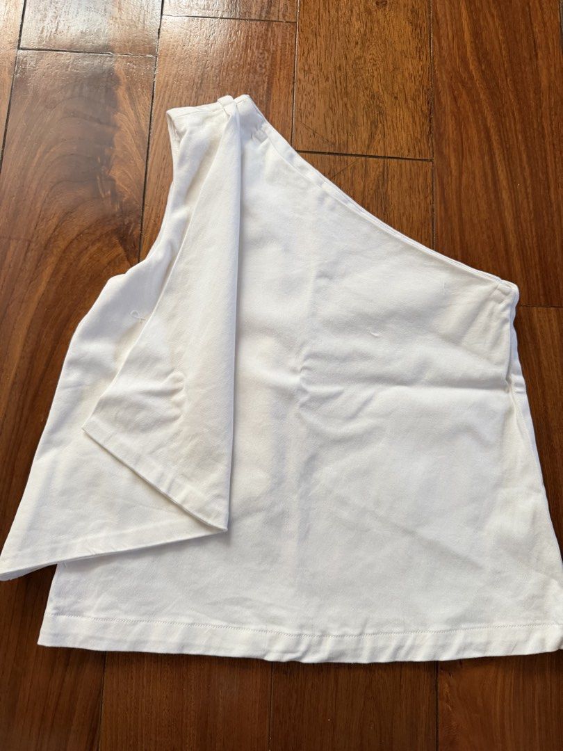 Crisp studio one side shoulder XS (Category: Blouses) located in Quezon City. Submitted by closet.cha (Listing ID 1465052390, Image 2). Description: Can pass as bnew hindi pa nasuot actually One side shoulder style Fits xs Fabric is nice linen feel but stretchy No issue This lovely lilac slip dress features a charming asymmetric lace-trimmed hem and delicate ruffle detailing.