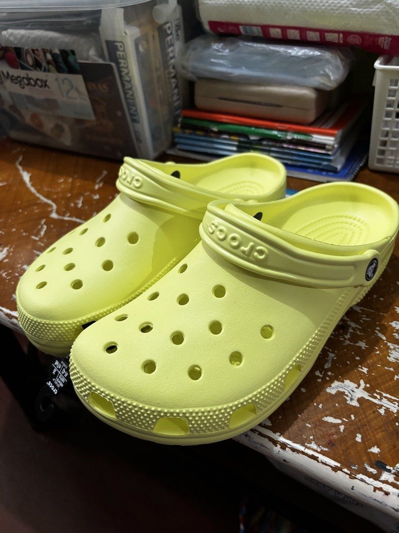Crocs Classic Clog Yellow Size M8 W10 (Category: Slippers & Slides) located in Mandaluyong City. Submitted by aceandres (Listing ID 1464989721, Image 1). Description: - Color: Bright Yellow - Size: Men's US 8 / Women's US 10 / EU 41-42 - Condition: Brand new with original store tag attached - Design: Iconic ventilation ports and secure pivoting heel straps - Material: Lightweight and comfortable foam construction.