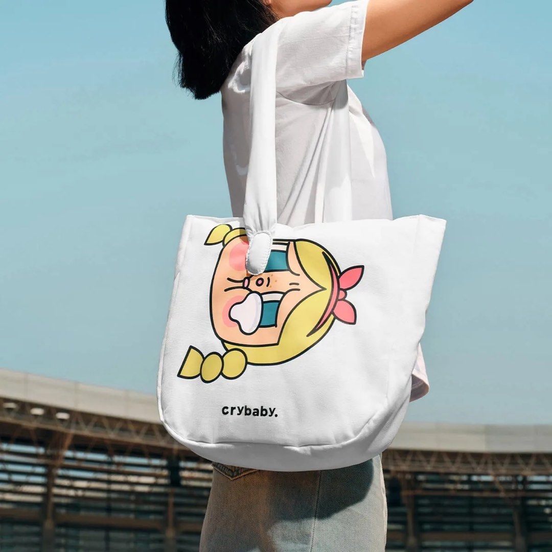 Crybaby White Graphic Tote Bag (Category: Tote Bags) located in Manila. Submitted by curatedbyei (Listing ID 1464986933, Image 2). Description: POPMART Crybaby Sunset Concert Series- Used Once only.