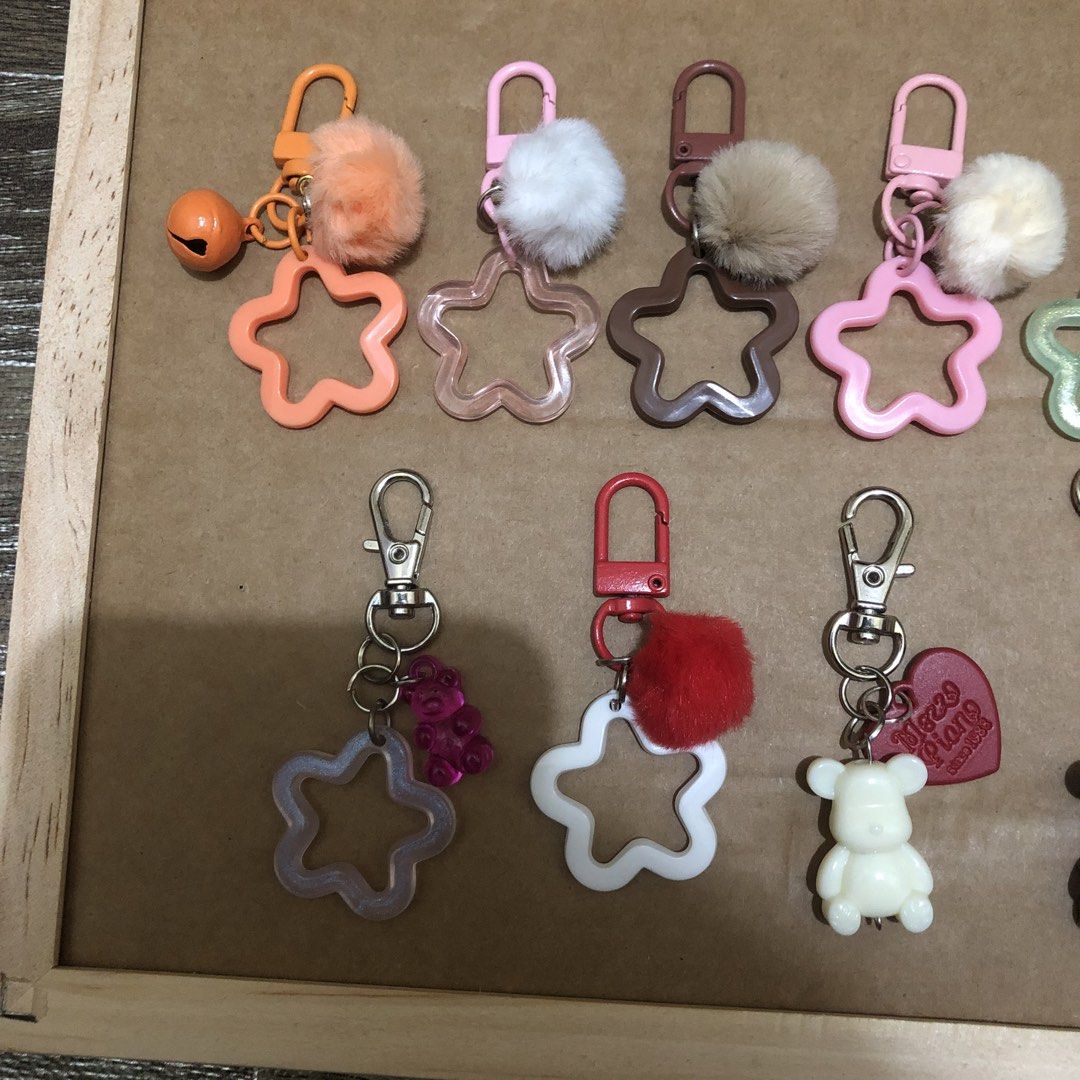 Cute Acrylic and Plush Pom Pom Keychains (Category: Plushies & Soft Toys) located in Manila. Submitted by tonettesells (Listing ID 1465107583, Image 3). Description: - 45 pesos per piece Adorable designs featuring fluffy pom poms, little bears, stars, and tassels - Equipped with a sturdy metal snap hook for easy clipping to bags, keys, or lanyards - Perfect for personalizing your everyday carry or as a thoughtful gift for friends - Multiple color