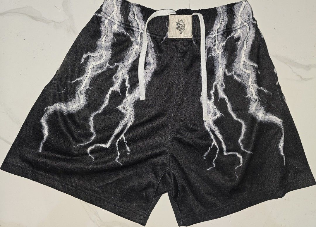 Darc Sport Lightning Print Mesh Shorts Size M (Category: Shorts) located in La Trinidad. Submitted by odin21 (Listing ID 1465074582, Image 1). Description: Darc Sport mesh shorts in black with white lightning graphics all over. Drawstring waist with branded aglets and interior tag numbered 222 of 1000. Back patch pocket on the right side. Breathable athletic fabric. Great gym or streetwear option..