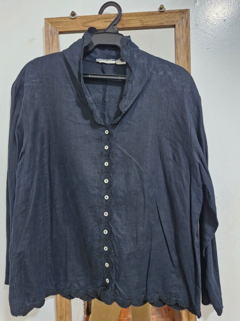 Black Long Sleeve Embroidered Button Down Blouse (Category: Longsleeves) located in San Juan City. Submitted by lss88 (Listing ID 1464972159, Image 1). Description: - Color: Black - Design: Floral embroidery down the front placket with matching delicate trim - Details: Contrast white buttons and a cute scalloped hem - Fit: Relaxed, lightweight, and collarless neckline - Styling: Easy to pair with casual denim or skirts.