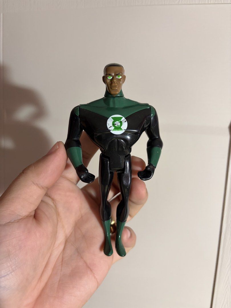 DC Comics Green Lantern John Stewart Action Figure (Category: Figurines & Statues) located in Plaridel. Submitted by moddedjarvis (Listing ID 1465170650, Image 1). Description: - Character: John Stewart Green Lantern (Justice League animated series era) - Outfit: Classic black and green suit with chest emblem - Articulation: Standard poseability - Condition: Minor surface scuffs from play and some paint chipping on the white chest logo - Authenti