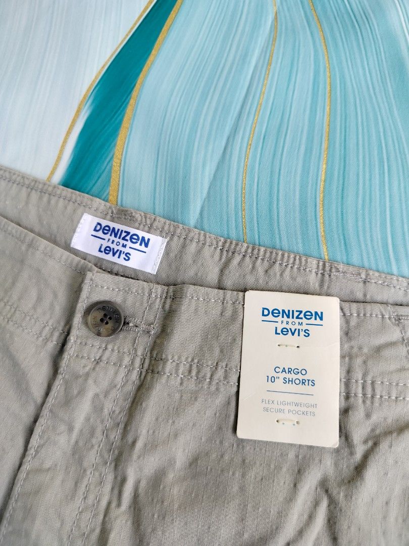 Denizen from Levi's Cargo 10" Shorts Grey W38 (Category: Shorts) located in Manila. Submitted by geraldquinto_917 (Listing ID 1464979067, Image 2). Description: - Brand: Denizen by Levi's - Style: Grey cargo shorts with original tags attached - Size: W38 - Material: Flex lightweight fabric for all-day comfort - Storage: Multiple secure pockets, featuring a convenient zip pocket on the right leg.