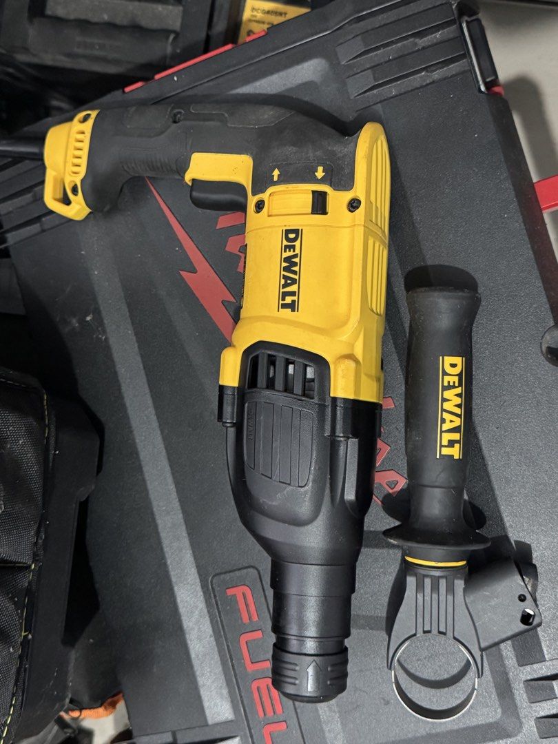 Dewalt D25133-QS SDS-Plus Rotary Hammer Drill (Category: Construction Tools & Equipment) located in Cavite. Submitted by marcuz1316 (Listing ID 1465158667, Image 2). Description: - Brand: Dewalt (Model: D25133-QS) - Power: 800W, 230V corded - Performance: Up to 1500 RPM and 5500 BPM impact rate - Inclusions: Side handle attachment included - Condition: Heavy-duty and reliable power tool for tough drilling tasks.