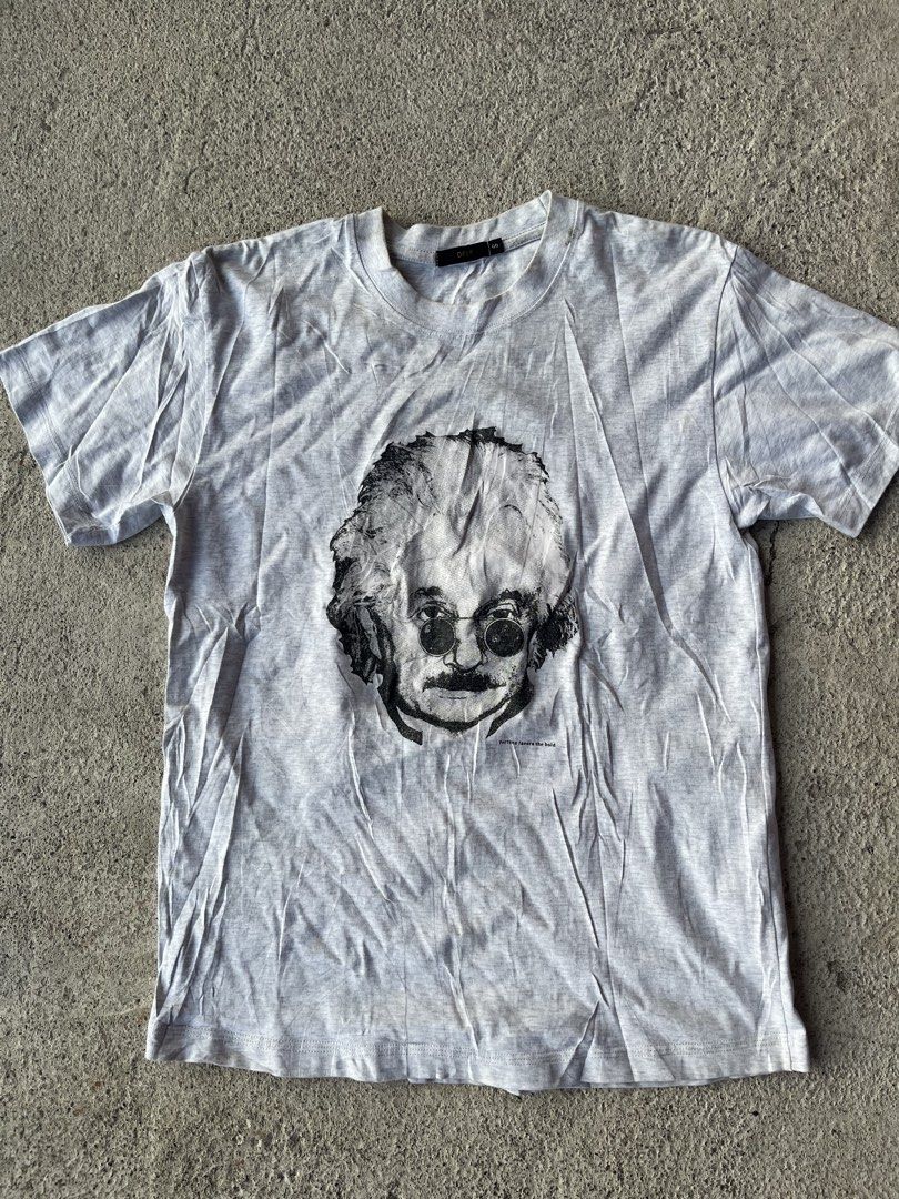DFLP Einstein Graphic Tee Grey Size S (Category: Tshirts & Polo Shirts ) located in Manila. Submitted by ljpiastro.031411 (Listing ID 1465071096, Image 1). Description: - Brand: DFLP - Size: Small (S) - Color: Grey - Material: Lightweight cotton blend - Design: Vintage Einstein graphic with "fortune favors the bold" text - Fit: Regular crew neck - Condition: Good, slightly wrinkled from storage (needs ironing).