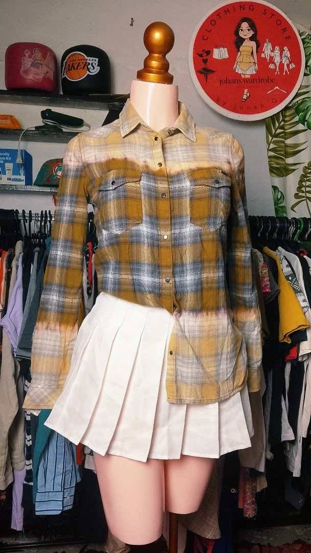 Diesel Yellow Grey Plaid Button Down Shirt (Category: Tshirts & Polo Shirts ) located in Manila. Submitted by jonahq.9 (Listing ID 1465080840, Image 2). Description: - Brand: Diesel - Color: Mustard yellow and grey plaid with bleached dip-dye effect - Material: 100% soft cotton flannel - Features: Long sleeves, double front pockets, snap button closure - Style: Casual, perfect for layering - Origin: Made in India.