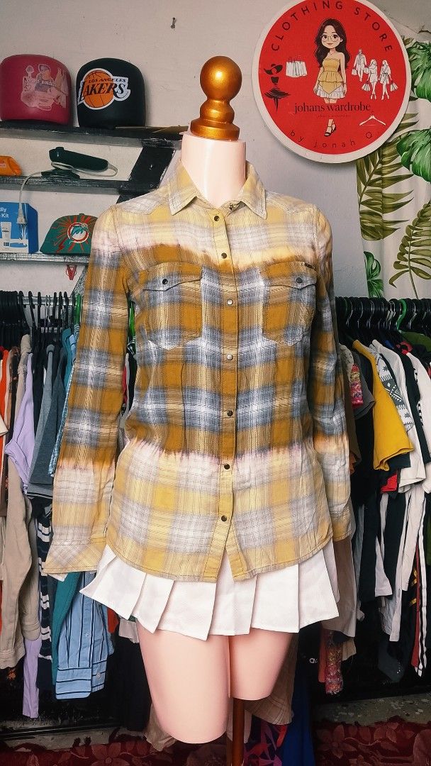 Diesel Yellow Grey Plaid Button Down Shirt (Category: Tshirts & Polo Shirts ) located in Manila. Submitted by jonahq.9 (Listing ID 1465080840, Image 3). Description: - Brand: Diesel - Color: Mustard yellow and grey plaid with bleached dip-dye effect - Material: 100% soft cotton flannel - Features: Long sleeves, double front pockets, snap button closure - Style: Casual, perfect for layering - Origin: Made in India.