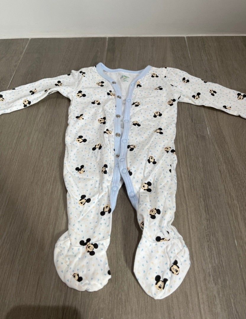 Disney Frogsuit Bundle 0-3 Months (Category: Babies & Kids Fashion) located in Manila. Submitted by krishanata22235 (Listing ID 1465093258, Image 2). Description: - Brand: Disney Baby - Size: 0-3 months - Quantity: Bundle of 3 footed rompers - Designs: Mickey Mouse print, light blue with 'Be Kind, Be Happy' text, and plain white - Material: Soft, comfortable cotton - Features: Convenient snap buttons down the front and legs for easy diaper change