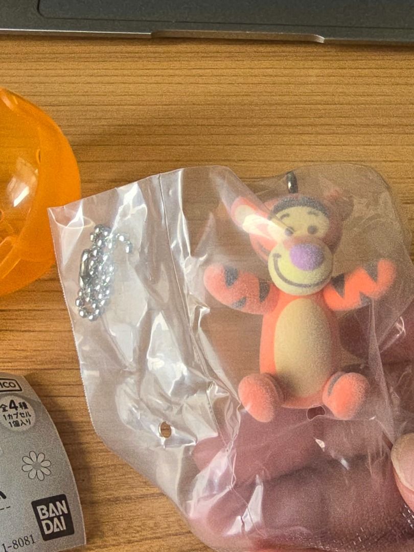 Disney Tigger Flocked Figurine Keychain Bag Charm (Category: Character Goods) located in Santa Rosa. Submitted by kaydecluttersnow (Listing ID 1464995039, Image 2). Description: Official Bandai Gacha from Tokyo, Japan. RFS: Wanted Pooh so this was an extra pull. - Adorable Tigger figurine keychain with a soft, flocked velvety texture - Features iconic orange stripes, cream belly, and a cute purple nose - Equipped with a sturdy silver ball chain f