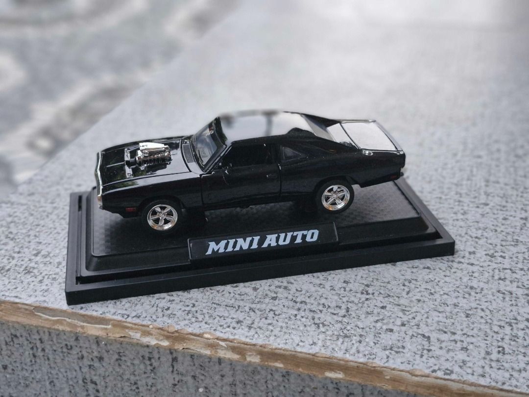 Dodge Challenger Diecast Model Black (Category: Vehicle & Diecast Models) located in Davao. Submitted by j_guitarist (Listing ID 1465146021, Image 1). Description: - Size: Length 16.5cm x width 6cm x height 4.5cm - Scale: 1:32 - Color: Black - Material: alloy (body), ABS plastic (bottom), rubber (wheel) - Display: Includes a black display base with the brand name plate - Features: Doors and front/trunk open smoothly. Sounds and lights effect. - C