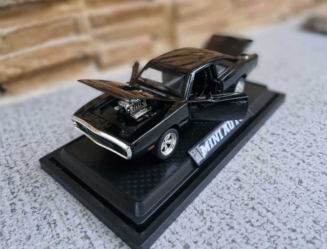 Dodge Challenger Diecast Model Black (Category: Vehicle & Diecast Models) located in Davao. Submitted by j_guitarist (Listing ID 1465146021, Image 3). Description: - Size: Length 16.5cm x width 6cm x height 4.5cm - Scale: 1:32 - Color: Black - Material: alloy (body), ABS plastic (bottom), rubber (wheel) - Display: Includes a black display base with the brand name plate - Features: Doors and front/trunk open smoothly. Sounds and lights effect. - C