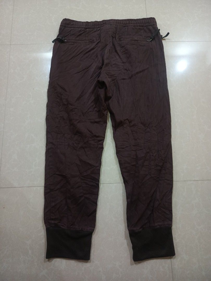 Dolce & Gabbana Brown Zip Jogger Pants (Category: Joggers) located in Cabatuan. Submitted by penthegreat (Listing ID 1465006082, Image 3). Description: AUTHENTIC 🔥🔥🔥 9/10 color rate and condition - Brand: Dolce & Gabbana - Color: Brown - Material: 98% cotton, 2% elastane (slight stretch for comfort) - Made in Italy - Waist: Adjustable drawstring - Cuffs: Ribbed at the ankles - Details: Functional metal zippers along both outer legs - Pockets: 