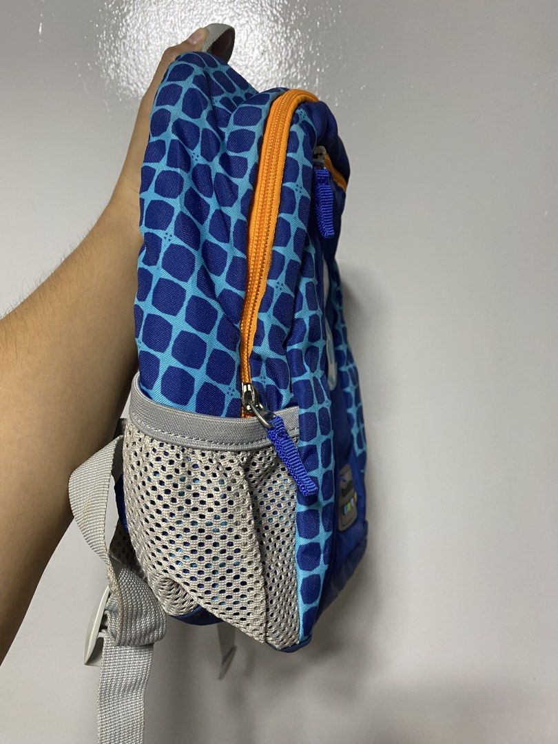 Dr. Kong Smart Kids Blue Dog Backpack (Category: Backpacks) located in Pasacao. Submitted by wengpullar37205 (Listing ID 1465097354, Image 3). Description: - Brand/Model: Dr. Kong Smart Kids Backpack - Color/Design: Blue with cute white dog embroidery (yellow spotted bandana) and orange zippers - Features: Side mesh pockets, breathable padded back panel, adjustable grey shoulder straps, and chest buckle - Condition: Used a few times, smooth zippe