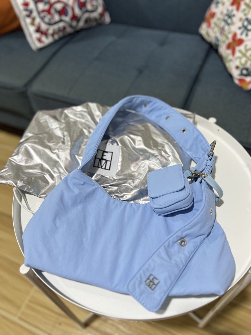 Editor’s Market shoulder bag (Category: Shoulder Bags) located in Davao. Submitted by bengscloset (Listing ID 1465037668, Image 2). Description: Brand: The Editor’s Market Color: Light Blue Material: Soft padded nylon with silver-tone hardware Features: Adjustable strap, buckle details, and attached front mini pouch for earphones Condition: Like new (with silver metallic dust bag) Clean inside and out, well-maintained 📌 No rush shipping. 📦 Ship