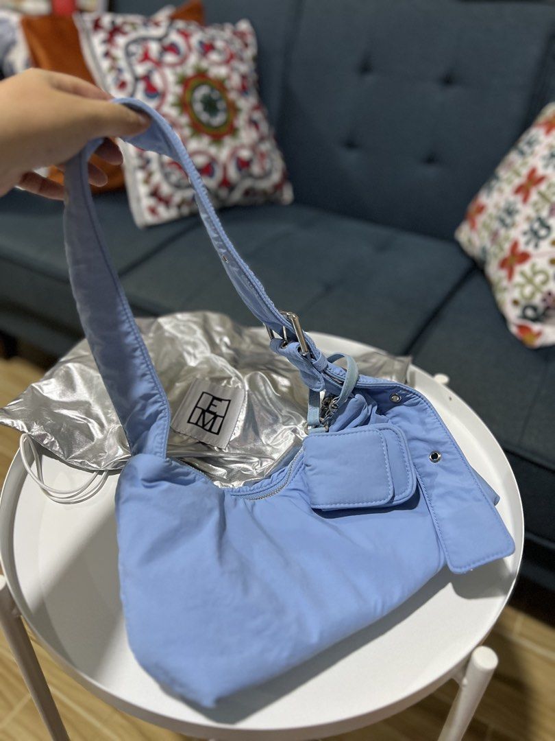Editor’s Market shoulder bag (Category: Shoulder Bags) located in Davao. Submitted by bengscloset (Listing ID 1465037668, Image 3). Description: Brand: The Editor’s Market Color: Light Blue Material: Soft padded nylon with silver-tone hardware Features: Adjustable strap, buckle details, and attached front mini pouch for earphones Condition: Like new (with silver metallic dust bag) Clean inside and out, well-maintained 📌 No rush shipping. 📦 Ship