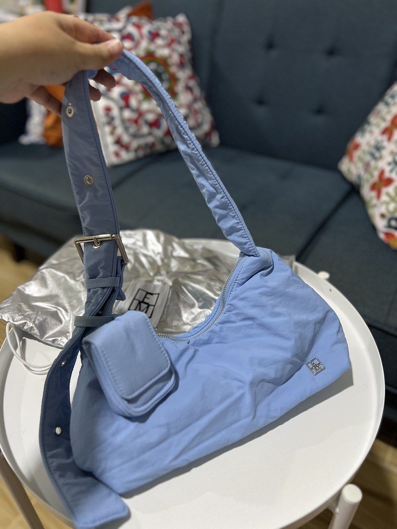 Editor’s Market shoulder bag (Category: Shoulder Bags) located in Davao. Submitted by bengscloset (Listing ID 1465037668, Image 1). Description: Brand: The Editor’s Market Color: Light Blue Material: Soft padded nylon with silver-tone hardware Features: Adjustable strap, buckle details, and attached front mini pouch for earphones Condition: Like new (with silver metallic dust bag) Clean inside and out, well-maintained 📌 No rush shipping. 📦 Ship