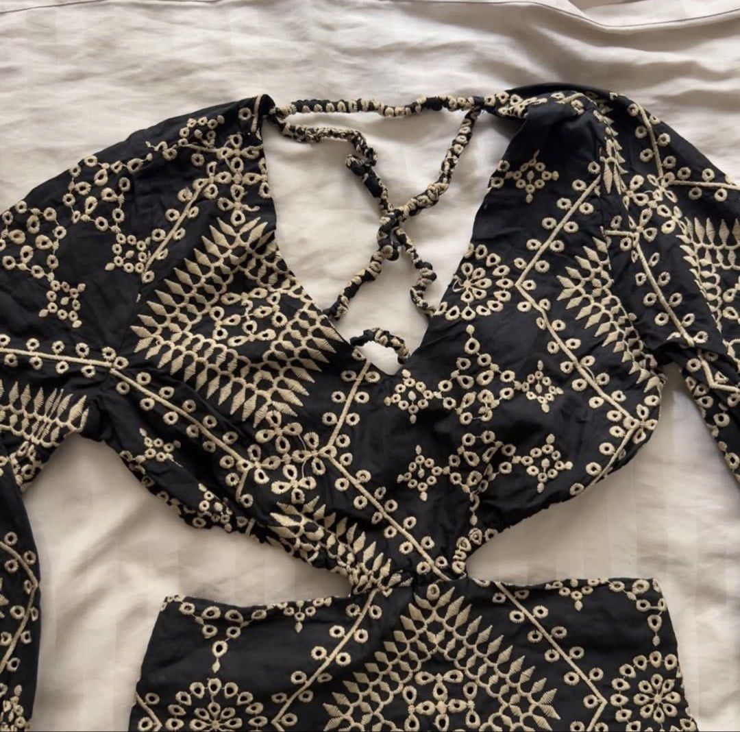 Embroidered Cut-Out Maxi Dress (Category: Dresses) located in Pasig City. Submitted by jenscloset86 (Listing ID 1465111949, Image 3). Description: Size: Small - Medium • Washed once but never worn. Measurement: Length: 50” Bust: 32-36” Sleeve: 19” Shoulder: 13” Waist: 28” - Stunning black maxi dress - Intricate beige embroidery - Plunging neckline with criss-cross detail - Flattering waist cut-outs - Long, billowy sleeves with elastic cuffs - Sca