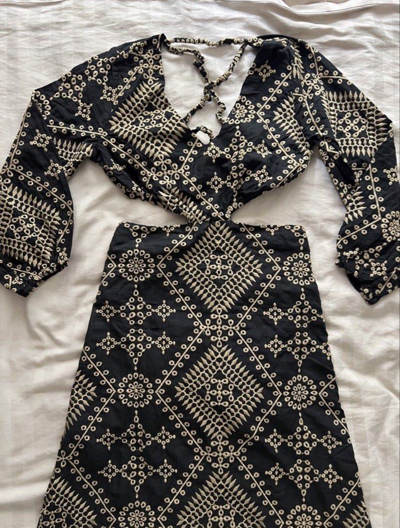 Embroidered Cut-Out Maxi Dress (Category: Dresses) located in Pasig City. Submitted by jenscloset86 (Listing ID 1465111949, Image 2). Description: Size: Small - Medium • Washed once but never worn. Measurement: Length: 50” Bust: 32-36” Sleeve: 19” Shoulder: 13” Waist: 28” - Stunning black maxi dress - Intricate beige embroidery - Plunging neckline with criss-cross detail - Flattering waist cut-outs - Long, billowy sleeves with elastic cuffs - Sca