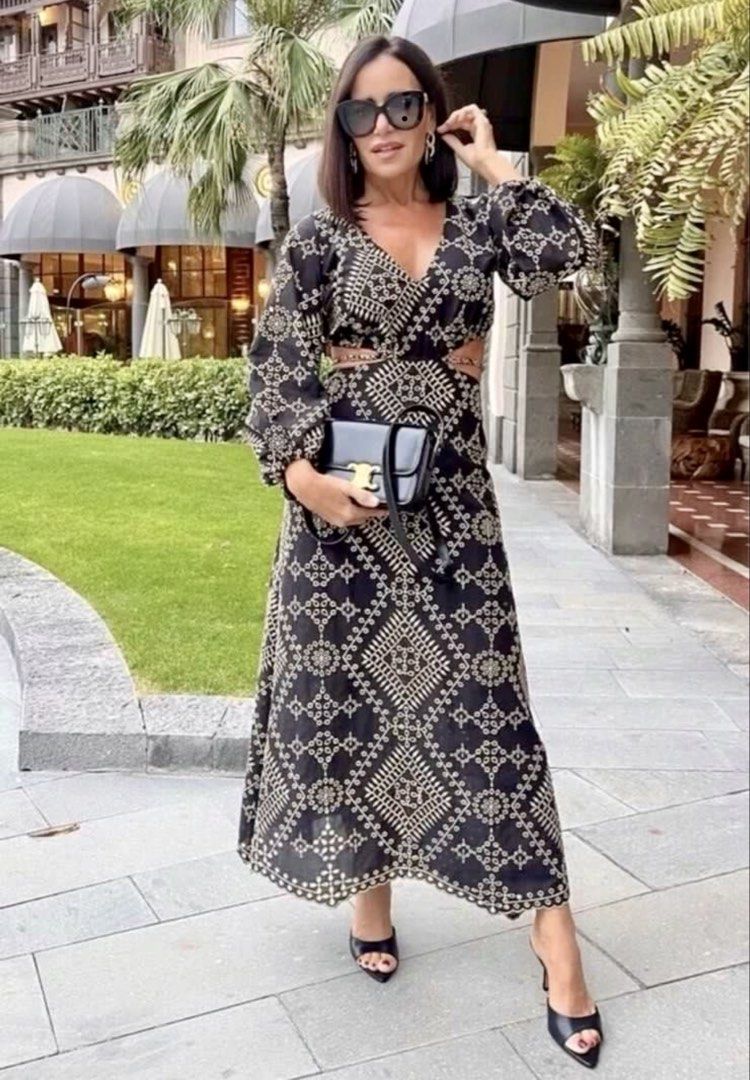 Embroidered Cut-Out Maxi Dress (Category: Dresses) located in Pasig City. Submitted by jenscloset86 (Listing ID 1465111949, Image 1). Description: Size: Small - Medium • Washed once but never worn. Measurement: Length: 50” Bust: 32-36” Sleeve: 19” Shoulder: 13” Waist: 28” - Stunning black maxi dress - Intricate beige embroidery - Plunging neckline with criss-cross detail - Flattering waist cut-outs - Long, billowy sleeves with elastic cuffs - Sca