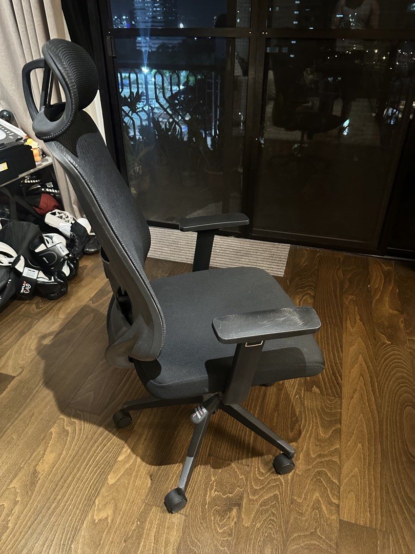 Ergonomic Mesh Office Chair with Headrest (Category: Office Furniture & Fixtures) located in Pasig City. Submitted by ajpfinds (Listing ID 1465070874, Image 2). Description: - Ergonomic office chair with breathable black mesh - Adjustable headrest and comfortable padded armrests - Sturdy five-star base with smooth-rolling caster wheels - Fully functional height adjustment and tilt lock lever - Solid build quality, very clean and work-ready.