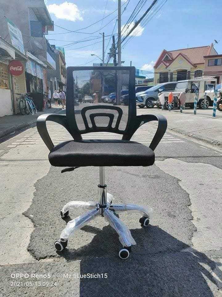 Ergonomic Mesh Office Chair with Wheels (Category: Office Furniture & Fixtures) located in Marikina City. Submitted by renshie (Listing ID 1465129454, Image 3). Description: - Ergonomic black mesh office chair with a breathable backrest - Chrome-plated metal base with smooth-rolling casters - Height-adjustable pne umatic gas lift lever - Comfortable curved armrests for long work hours - Multiple units available for matching workspaces.