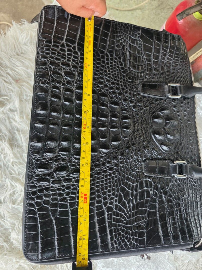 Faniya Black Crocodile Embossed Leather Briefcase (Category: Briefcases) located in Lemery. Submitted by venus23 (Listing ID 1465117689, Image 3). Description: - Brand: Faniya - Color: Classic Black - Material: Glossy crocodile embossed leather - Size: Roughly 15 inches across - Handles: Twin top carry handles + detachable shoulder strap - Closure: Secure top zip closure - Interior: Printed fabric lining with a convenient zippered pocket and bran