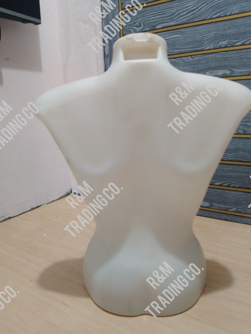 Female Torso Mannequin Display Form White Plastic (Category: Blouses) located in Pasig City. Submitted by mara_0125 (Listing ID 1465019442, Image 2). Description: - Color/Material: Durable white plastic - Design: Hollow back with a convenient hanging hook at the top collar - Base: Flat bottom for stable freestanding display - Ideal For: Showcasing shirts, blouses, and dresses - Best Uses: Product photography, online selling, and retail displays -