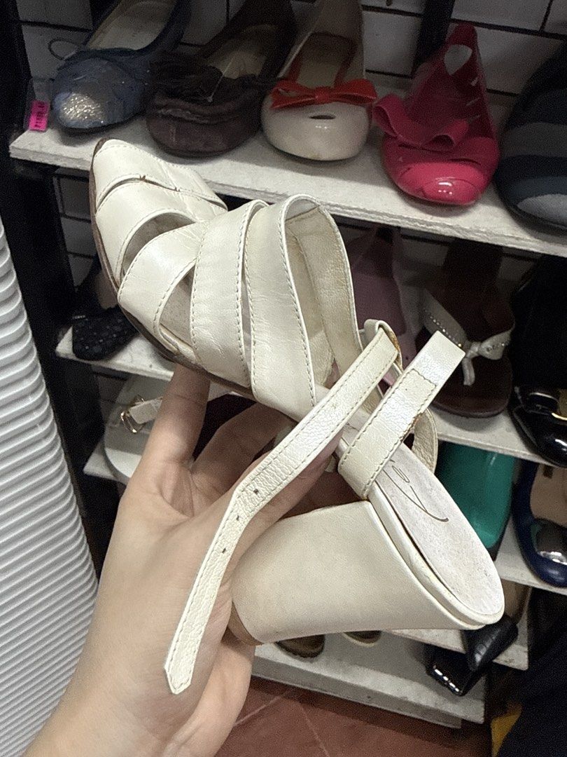 Femme White Strappy Heels Sandals (Category: Heels) located in Manila. Submitted by fastlion.584bdf (Listing ID 1465067367, Image 3). Description: - Brand: Femme - Style: Open toe strappy heels with a chunky block heel for steady support - Color: Versatile creamy off-white - Closure: Adjustable ankle strap with buckle - Condition: Light wear on soles and insoles from previous use - Perfect for dressing up or casual outings.