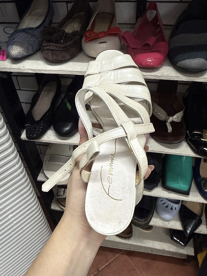 Femme White Strappy Heels Sandals (Category: Heels) located in Manila. Submitted by fastlion.584bdf (Listing ID 1465067367, Image 2). Description: - Brand: Femme - Style: Open toe strappy heels with a chunky block heel for steady support - Color: Versatile creamy off-white - Closure: Adjustable ankle strap with buckle - Condition: Light wear on soles and insoles from previous use - Perfect for dressing up or casual outings.