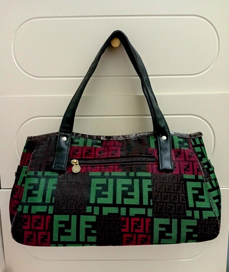 Fendi Geometric Pattern Tote Shoulder/hand bag (Category: Luxury Bags & Wallets) located in Navotas City. Submitted by ms.soulana (Listing ID 1464979010, Image 3). Description: PreOwned Lightly Used Fendi Multi Color Geometric Pattern Shoulder /handbag - Design: Green, burgundy, and dark brown geometric block pattern with a faux-crocodile center panel - Accents: Silver-tone rivets on black shoulder handles and small gold studs - Pockets: Exterior
