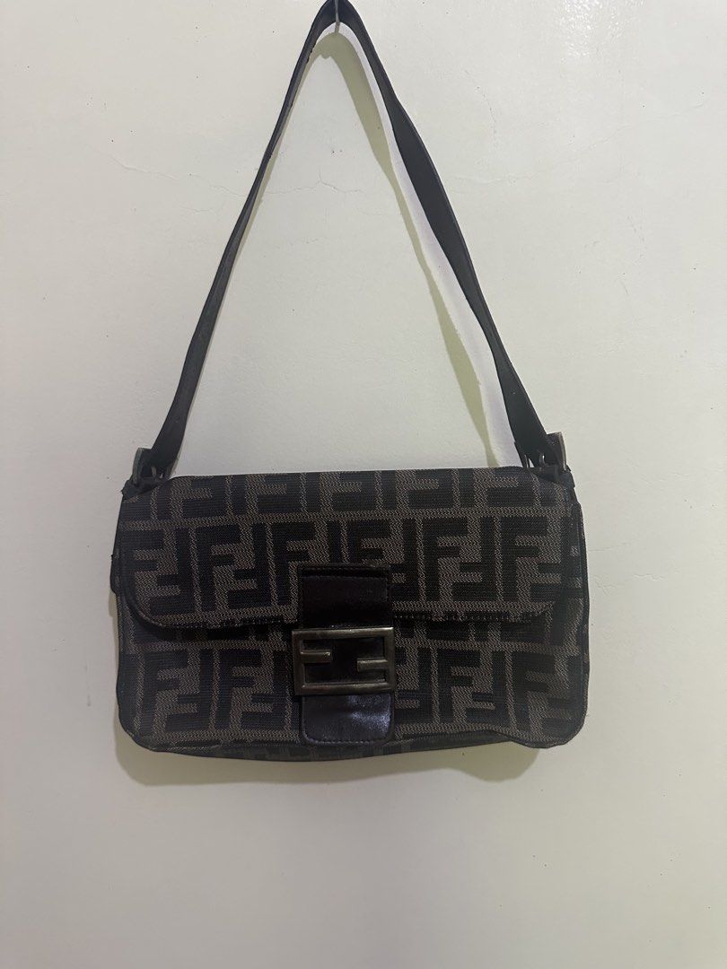 Fendi Zucchino FF Canvas Shoulder Bag (Category: Luxury Bags & Wallets) located in Tagum. Submitted by ritarits572 (Listing ID 1464978859, Image 1). Description: - Fendi shoulder bag in iconic black and grey Zucchino canvas with FF monogram pattern - Adjustable leather strap for a comfortable, customizable fit - Front flap closure with secure magnetic snap and engraved hardware - Spacious interior featuring a zippered pocket with Fendi logo pull 