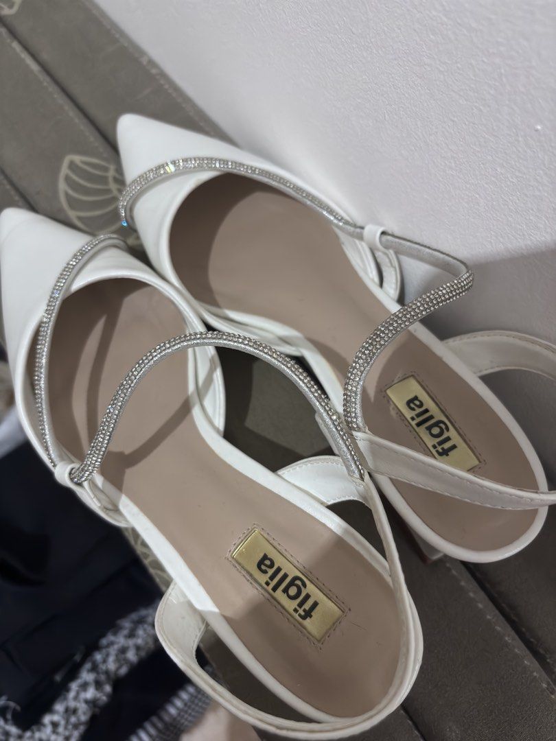 Figlia White Heels (Category: Heels) located in Manila. Submitted by niellaeun (Listing ID 1465048814, Image 1). Description: Still negotiable for sure buyers Original Price: 1,600 Excellent Condition, with box Used once Size: 37-38 .