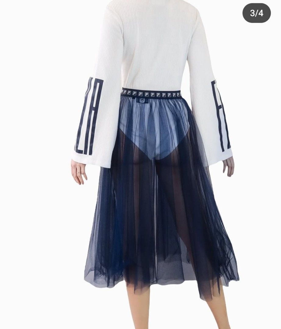 Fila Blue Mesh Tulle Midi Skirt (Category: Skirts) located in Manila. Submitted by PrinceDani.Clothing (Listing ID 1465105600, Image 2). Description: fila blue mesh skirt 2xl on tag Size 30-40in waist 30in length excellent condition .