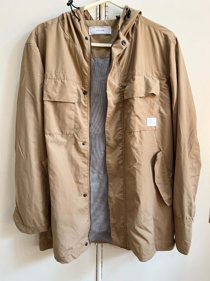 Five Four Tan Hooded Utility Jacket (Category: Coats, Jackets and Outerwear) located in Iloilo. Submitted by franzventures (Listing ID 1464985553, Image 1). Description: Nine Four jacket in tan. Hooded style with adjustable pull cords. Zipper front closure plus snap buttons down the placket. Dual chest flap pockets and side hand pockets. Striped fabric lining inside. White branded patch on the left chest pocket. Lightweight outer fabric, great tr