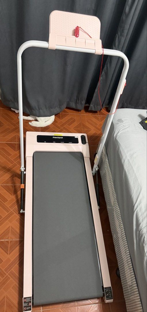 FlexiSpot WPS02 Walking Treadmill Pink (Category: Cardio & Fitness Machines) located in Taguig. Submitted by richellenazario (Listing ID 1465140872, Image 1). Description: FlexiSpot WPS02 portable walking treadmill in pink. 40.5x15.7 inch walking area, handles up to 264lbs. Built-in digital display tracks time, speed, distance, and calories. Includes upright handrail with device holder and red safety tether. Remote control operated. Great for hom