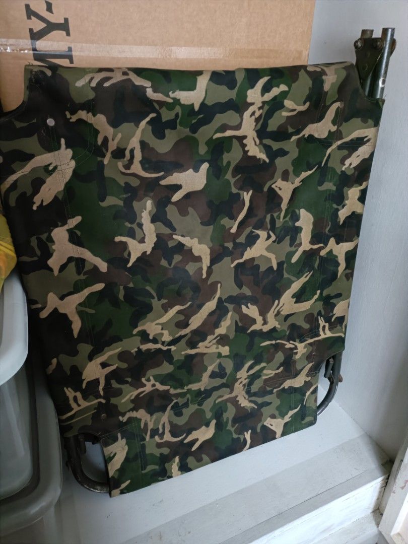 Foldable Camouflage Camping Bed Camping Cot (Category: Hiking & Camping) located in Quezon City. Submitted by cataleya0723 (Listing ID 1464987148, Image 1). Description: - Green camouflage folding bed frame - Sturdy metal legs and heavy-duty fabric for durability - Folds flat for easy storage and transport - Ideal for camping, outfield training, or extra home sleeping space - Space-saving design fits neatly in a closet.