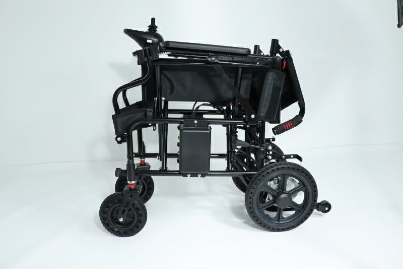 Foldable Electric Wheelchair with Joystick Controller and Battery Pack (Category: Wheelchairs) located in Caloocan City. Submitted by marcusalde44223 (Listing ID 1465021223, Image 2). Description: - Color: Black frame with stylish teal and grey cushioned seating - Control: Built-in right armrest joystick - Performance: Dual rear motors with large rear wheels and front casters - Comfort & Safety: Fold-away footrests, safety lap belt, and under-sea