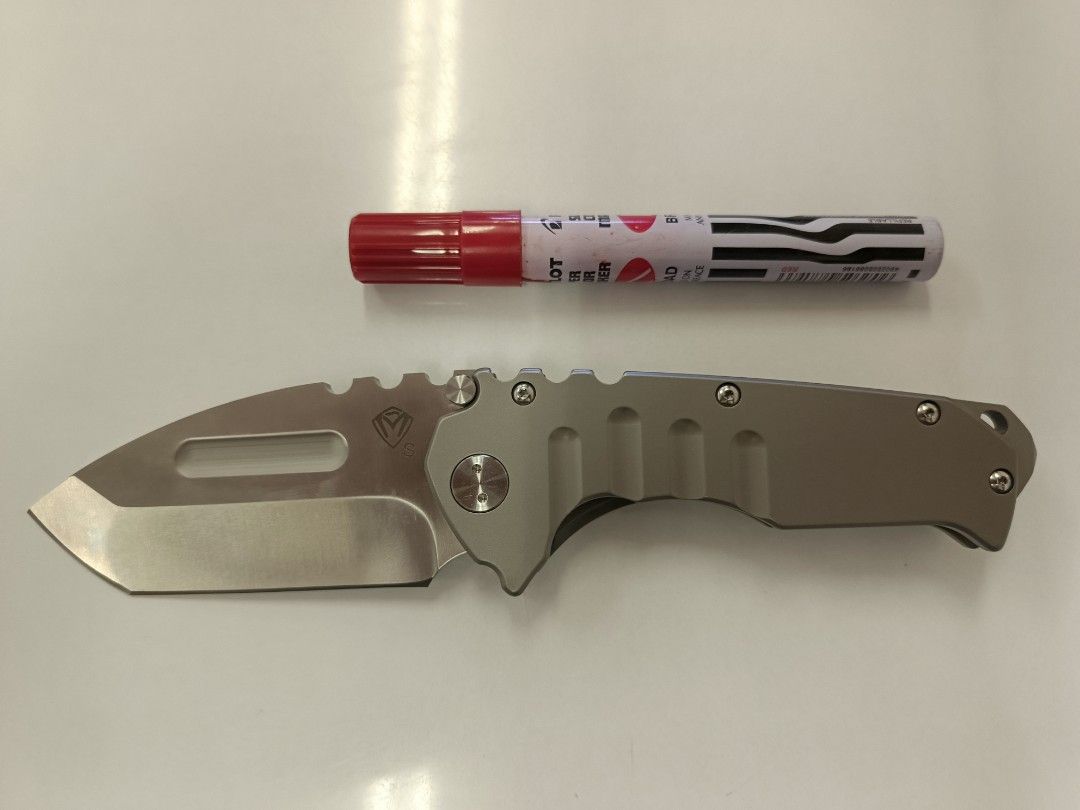 Folding Knife - Medford Praetorian - Clone Only (Category: Knives & Chopping Boards) located in Bacolod City. Submitted by viclawrence (Listing ID 1464976694, Image 2). Description: - Blade Material: D2 steel for durability and edge retention - Handle: Titanium-colored with ergonomic finger grooves for a comfortable grip - Deployment: Dual thumb studs for fast, smooth one-handed opening - Safety: Reliable lock mechanism keeps the blade securely i