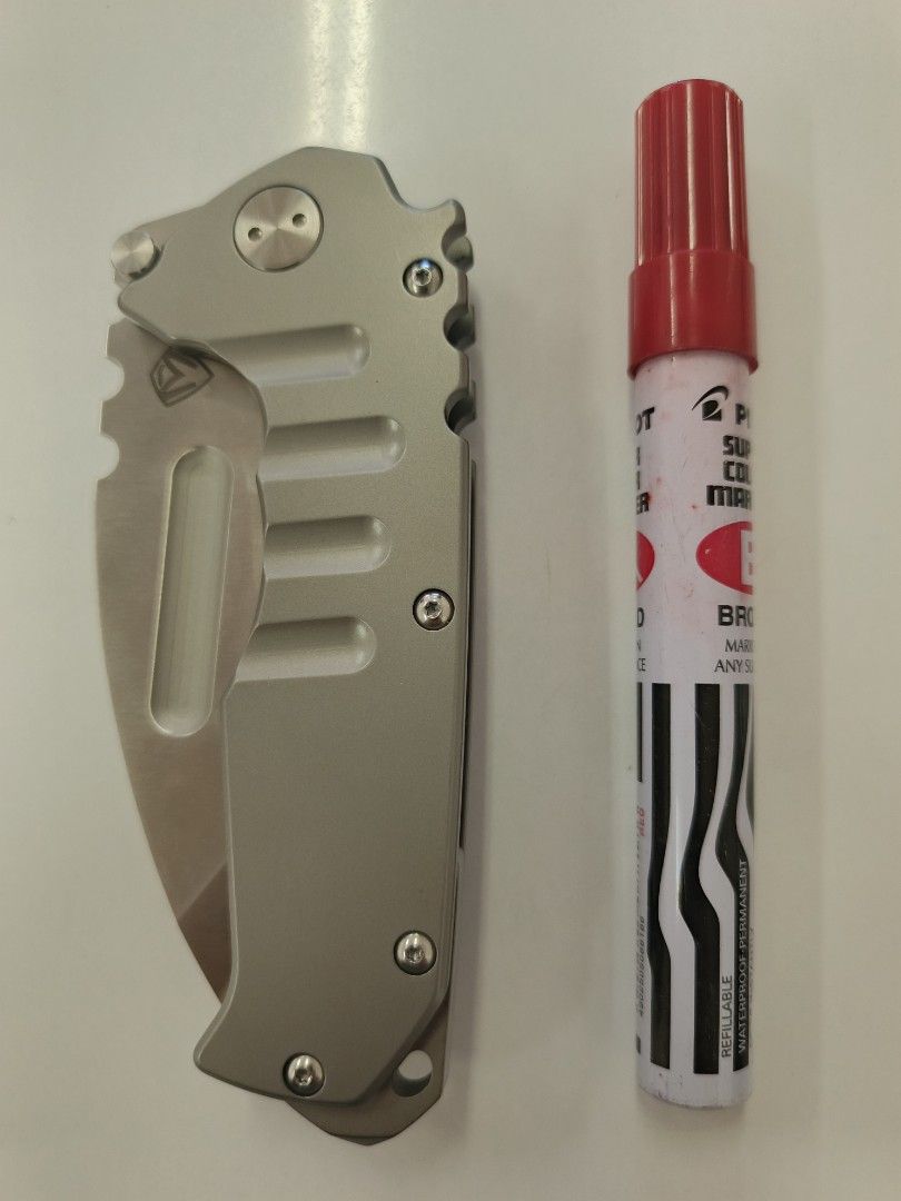 Folding Knife - Medford Praetorian - Clone Only (Category: Knives & Chopping Boards) located in Bacolod City. Submitted by viclawrence (Listing ID 1464976694, Image 3). Description: - Blade Material: D2 steel for durability and edge retention - Handle: Titanium-colored with ergonomic finger grooves for a comfortable grip - Deployment: Dual thumb studs for fast, smooth one-handed opening - Safety: Reliable lock mechanism keeps the blade securely i