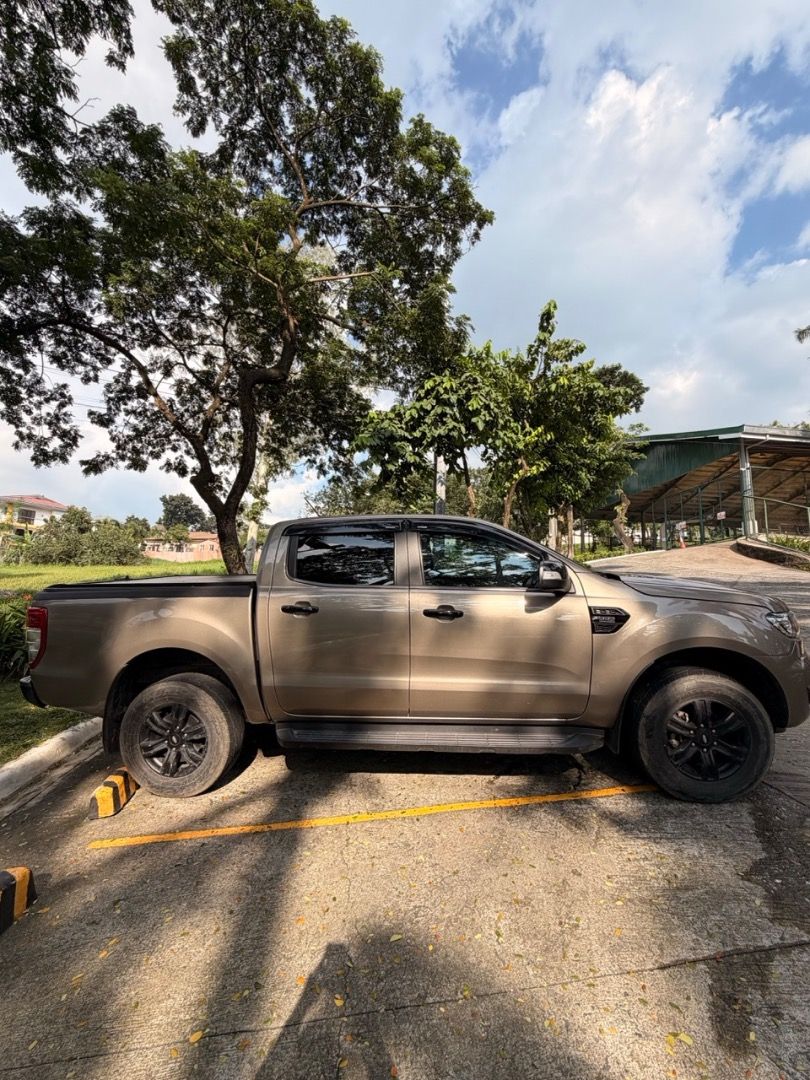 Ford Ranger (Category: Used Cars) located in Angono. Submitted by crispy_sisig (Listing ID 1465095778, Image 3). Description: Recent upgrades and purchases Stek NEX ceramic tint, installed April 2026. Good heat rejection and a premium film. Brand-new Amaron battery, bought June 2026. Supra roller lid. Maintenance All preventive maintenance done on schedule, with no skipped interval. Accident history Bumper replaced and hood repainted after a moto