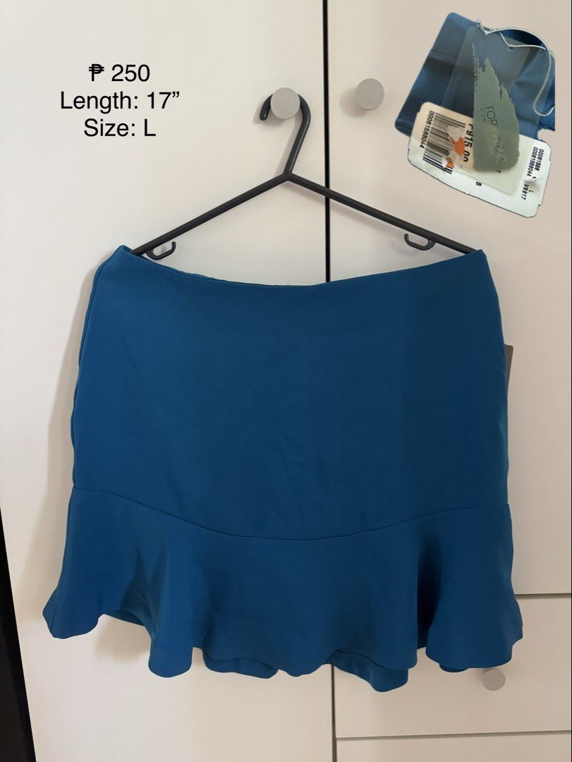 Forever 21 Blue Ruffle Hem Skirt Size L (Category: Skirts) located in Binan City. Submitted by izza1311 (Listing ID 1464997846, Image 1). Description: - Brand: Forever 21 - Item: Blue Ruffled Hem Skirt - Size: Large - Length: 17 inches - Condition: Brand new with original store tag attached - Style: Flared, flowy lower portion with vibrant blue color.