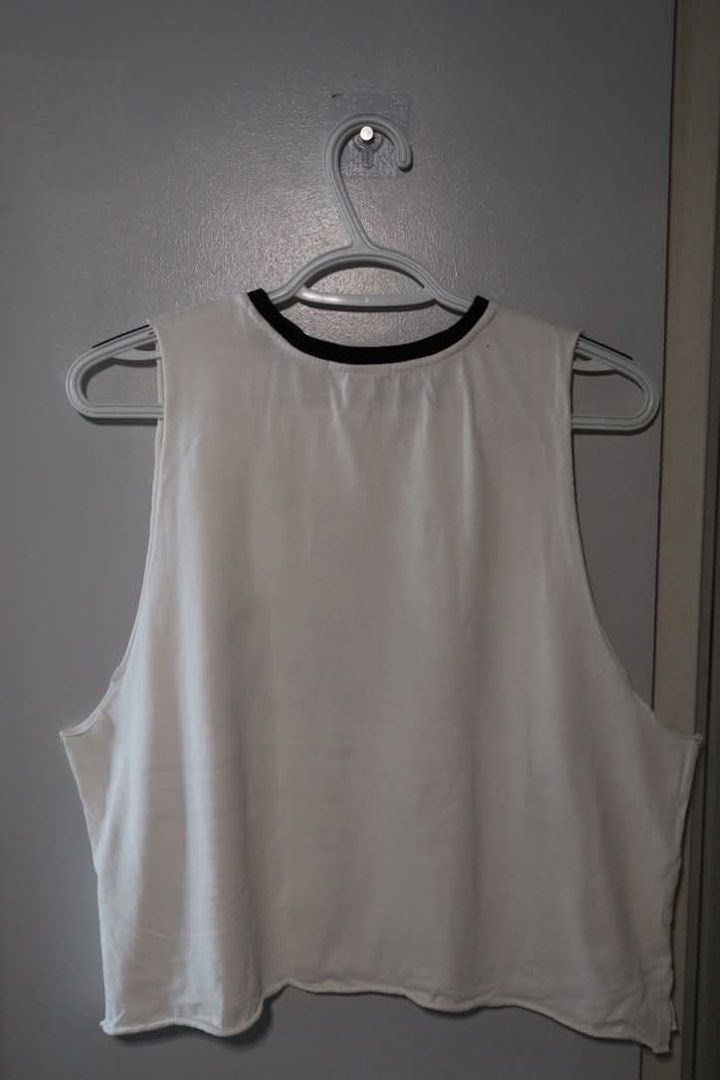 Forever 21 Tank Top (Category: Sleeveless) located in Manila. Submitted by leivic (Listing ID 1465058059, Image 3). Description: - Brand: Forever 21 - Style: Sleeveless crop top with relaxed fit - Details: Black contrast trim on neckline & raw cut hem - Design: Front graphic print "The Faded Where Is My Mind 2016 New World Tour" - Condition: Excellent / Pre-loved (ready to wear).