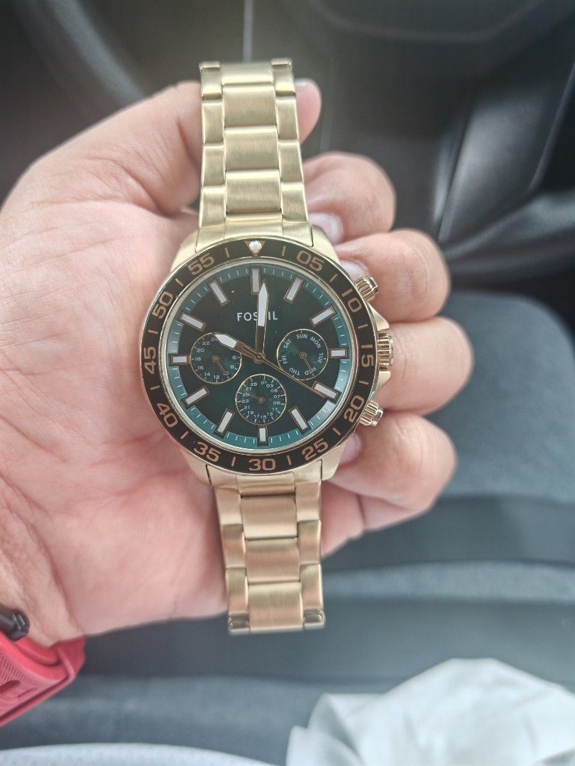 Fossil Gold Tone Chronograph Watch with Green Dial (Category: Women's Watches) located in Makati City. Submitted by ruffyjesusmacapugay (Listing ID 1465018659, Image 2). Description: - Brand: Fossil - Style: Chronograph watch in gold-tone with black bezel - Dial: Striking green dial with day, date, and 24-hour sub-dials - Strap: 22mm metal bracelet with secure deployment clasp - Specs: All stainless steel, 5 ATM water resistance - Condition: Norm