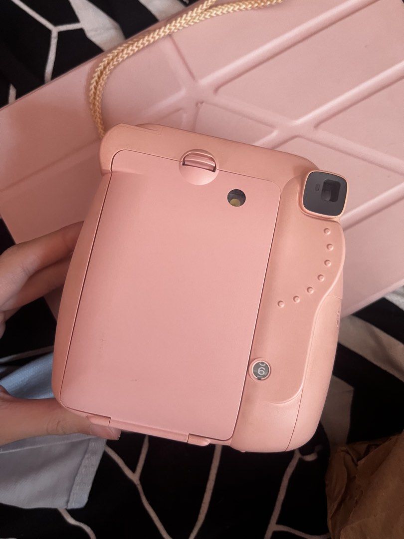 Fujifilm Instax Mini 8 Pink Instant Camera (Category: Cameras) located in Antipolo. Submitted by trix.0429 (Listing ID 1465030911, Image 2). Description: - Authentic Fujifilm Instax Mini 8 in a cute pink shade - Compact and lightweight body with an attached wrist strap - Built-in flash located right above the lens for easy low-light shooting - Simple manual exposure adjustment ring around the lens barrel - Clean exterior plastic shell with a prop