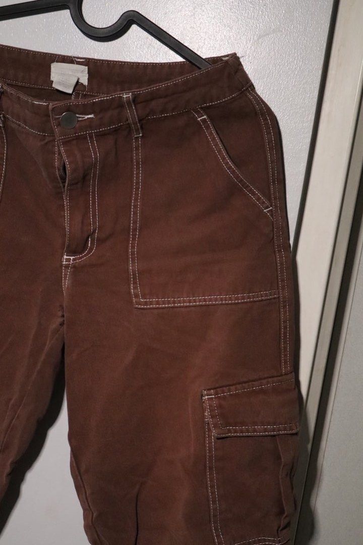 Full Tilt Brown Cargo Pants White Stitching (Category: Jeans) located in Manila. Submitted by leivic (Listing ID 1465066150, Image 1). Description: - Brand: Full Tilt - Color: Brown with contrasting white stitching - Material: Sturdy twill fabric - Features: Multiple utility pockets on front and back legs - Closure: Classic button and zip fly - Style: Streetwear staple, perfect for casual outfits - Condition: Excellent / Pre-loved (ready to wear)